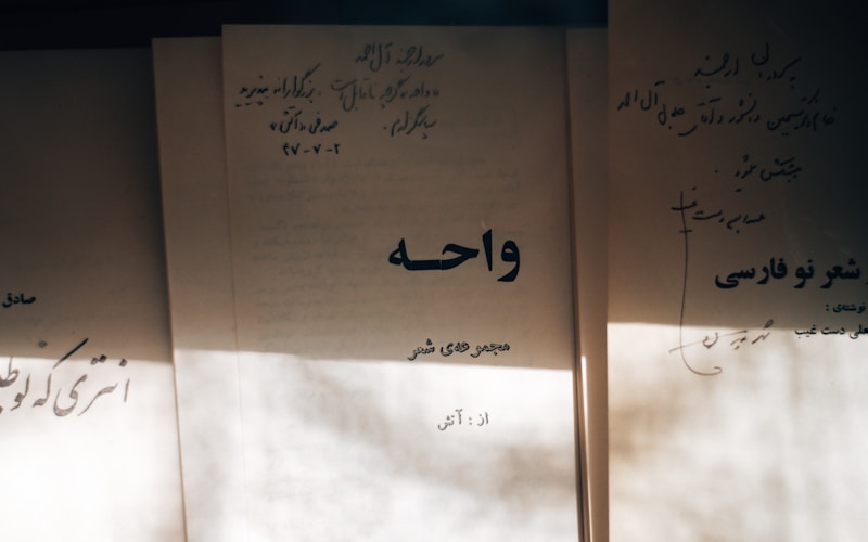 Old books with handwritten Arabic script
